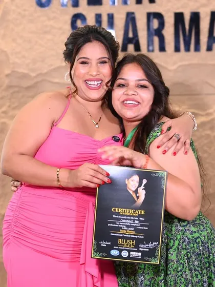 This moment is why I love teaching. Seeing my student's happiness as she receives her professional makeup artist certificate is the real reward. You could be next.