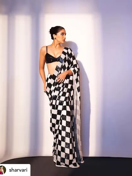 Sharvari Wagh looking chic in a modern saree by Manish Malhotra. The makeup is sharp and defined, with a strong focus on the eyes to match the graphic pattern of the outfit.