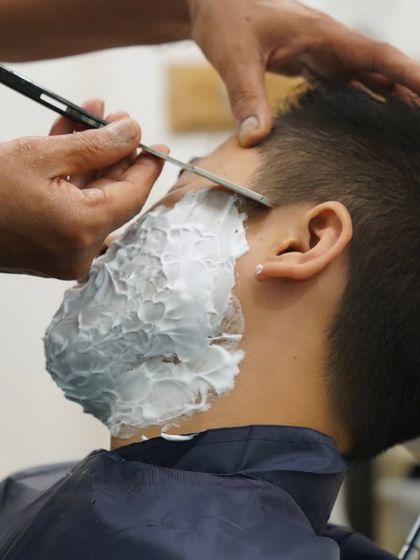 I use a traditional straight razor for the ultimate in precision and closeness. This technique, performed by my skilled hands, provides a superior, long-lasting finish that modern razors can't match.
