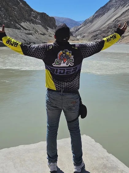 A rider in our official BMR jacket takes in the breathtaking view at the Sangam of the Indus and Zanskar rivers in Ladakh. This image captures the essence of our rides: epic landscapes and the profound sense of camaraderie that defines our brotherhood.