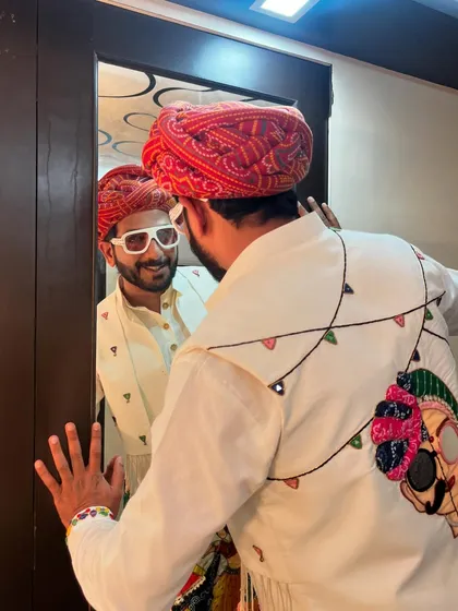 This Navratri look is all about the details. The back of the jacket features a modern skull design mixed with traditional elements, showing that ethnic wear can have an edge.