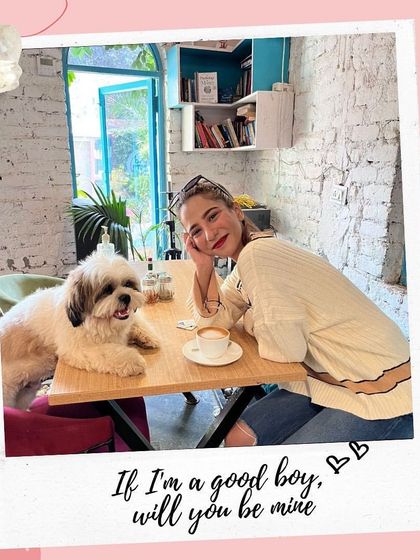 "If I'm a good boy, will you be mine?" Our resident Shih Tzu, Tofu, poses with a guest for a Valentine's photo.