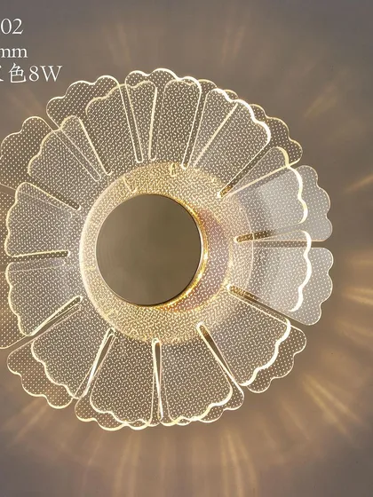 A flower-shaped wall or ceiling light with a beautiful acrylic design that scatters light in a decorative pattern.