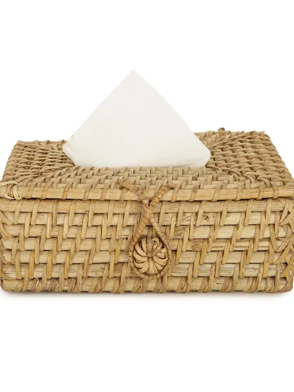 A close-up of our woven rattan tissue box holder against a clean white background. The detailed craftsmanship and natural material make it a lovely, eco-friendly addition to any home or office.