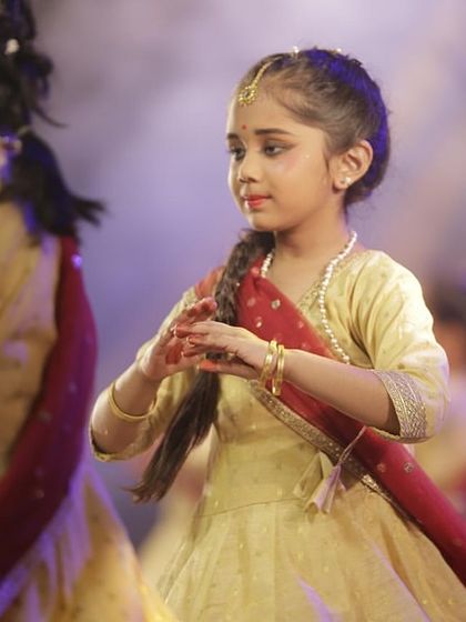 One of our youngest disciples performing with focus and joy at Varshik Utsav 2024.