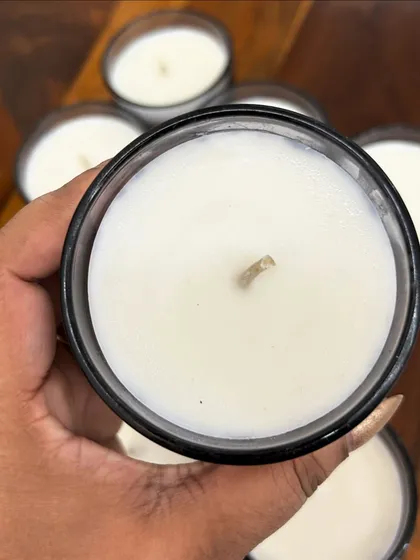 A close-up of our simple yet elegant glass jar candle. It's a versatile option that can be customized with any fragrance, color, and label to match your brand's unique style.