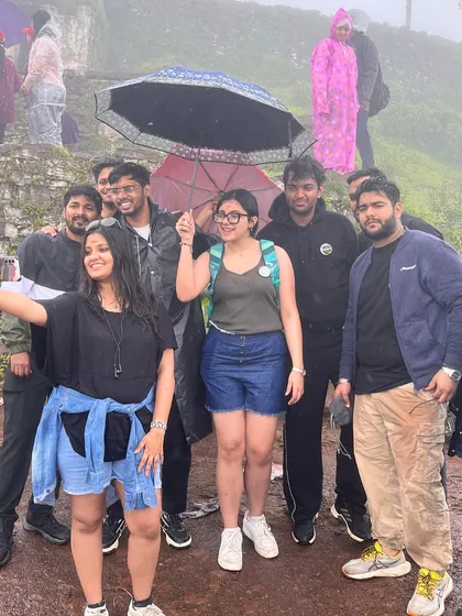 A candid selfie moment during a misty and rainy trek in Chikmagalur. These are the spontaneous, happy moments that make our trips special.