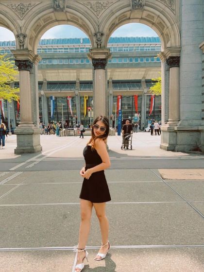 A throwback to my trip to Switzerland, wearing a simple black dress. This shows my international travel content.