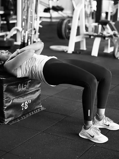 Building a strong posterior chain with elevated glute bridges. This exercise is crucial for hip strength and stability.