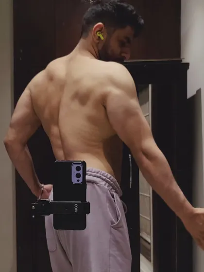 Years of consistency. Another angle showing the back muscles built through countless hours of training.
