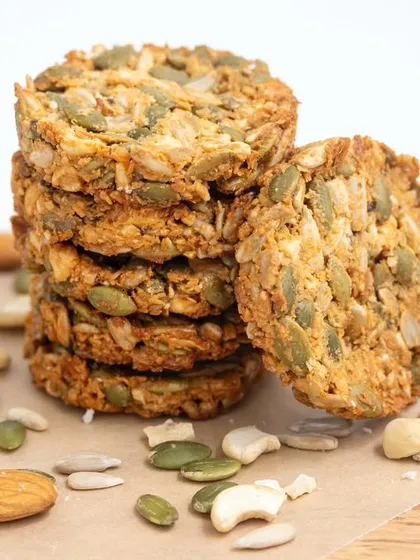 A close-up of our healthy multi-seed cookies. They are crunchy, satisfying, and packed with protein and fiber, making them a great snack for any time of day.