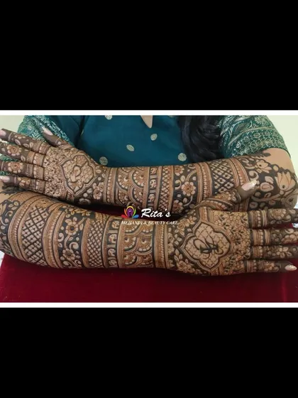 The back of the hands, showing a full-coverage design that is both traditional and elegant, perfect for a bride.
