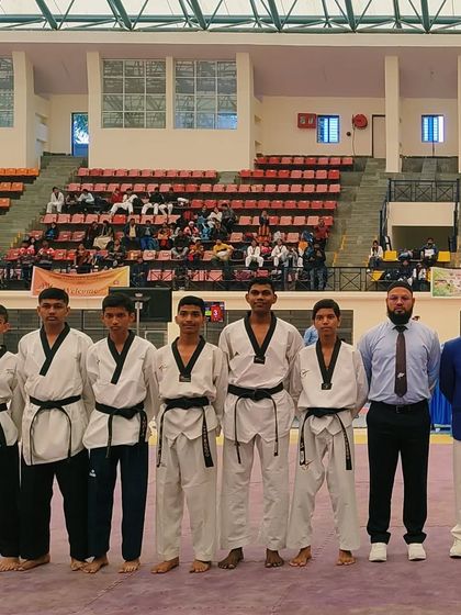 The junior boys' team lined up at the National Championship. Representing Karnataka is an honor that our students take very seriously.