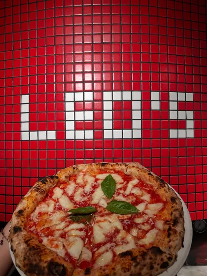 The OG, the classic, the one and only Margherita, posing right where it belongs. Simple ingredients, done right, fresh from our wood-fired oven. This is the pizza that started it all.