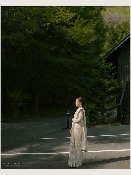 A bride standing on a quiet road in the Japanese countryside. This environmental portrait tells a story of adventure and love in a unique destination.