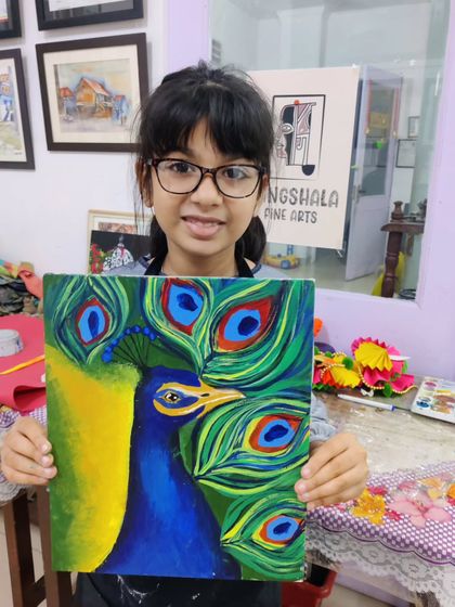 A young student paints a vibrant peacock, learning to blend the rich blues and greens of its feathers.