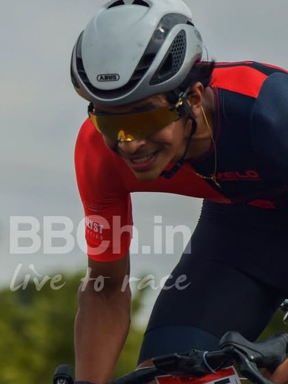 The grimace of determination. This close-up shot captures the intense effort required to stay at the front of a high-speed Crit race.