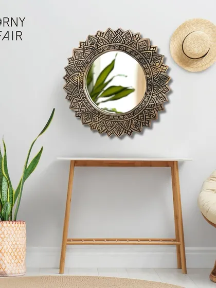 A mirror does more than reflect; it adds light and art to your walls. This piece, with its frame intricately carved from mango wood, is a testament to the beauty of Indian craftsmanship and brings a warm, rustic feel to your entryway or living room.