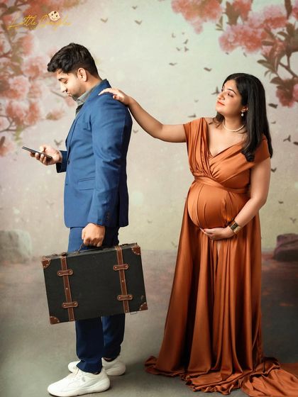 Adding a little bit of fun and drama to their session. This playful pose with the suitcase tells a story and creates a unique memory.