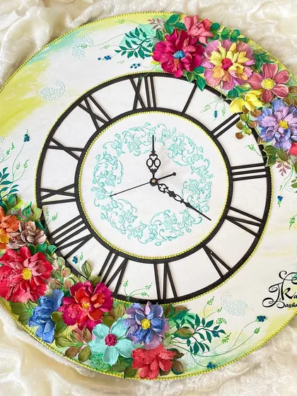 This large 20-inch wall clock shows how art can be functional. I designed it with a clean, classic face to let the cascade of colorful, hand-sculpted flowers be the star, turning a simple clock into a beautiful piece of home decor.