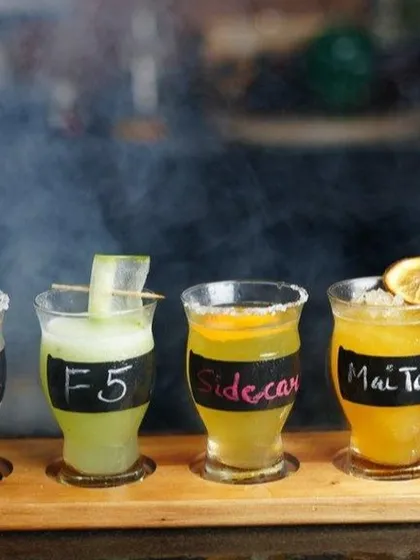 A flight of our classic cocktails: Gimlet, F5, Sidecar, and Mai Tai. It's a great way to sample some of the timeless drinks we offer.
