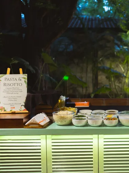 A live Pasta & Risotto station, with all the fresh ingredients ready for guests to customize their dish.