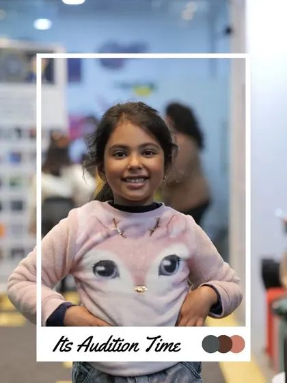 A big, happy smile from this participant shows she's having a great time at the auditions. That's what it's all about.