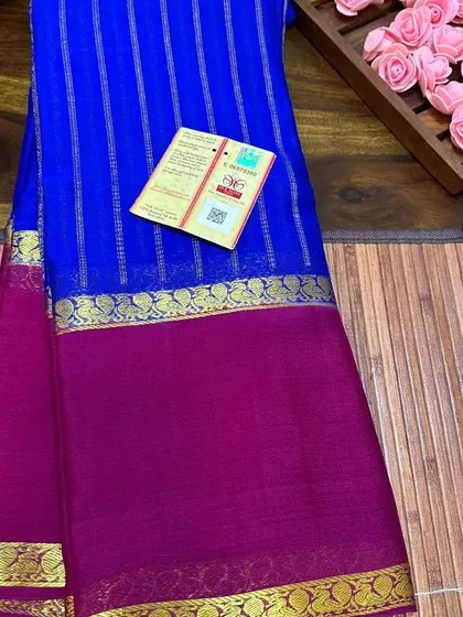 The royal blue and rani pink wrinkle crepe saree, showing the beautiful texture.