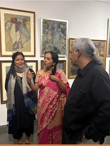 Visitors discussing the artworks at the Vidya Bhushan preview night.