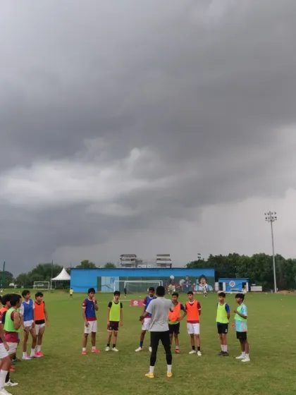 A training session under dramatic skies. No matter the weather, our players show up ready to work and improve their game.