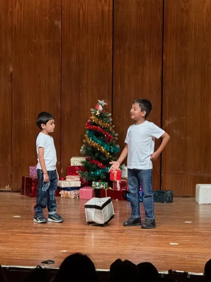 A dramatic moment between two actors, showcasing their ability to convey emotion and story.