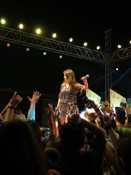 Reaching out to the audience during a massive show in Indore. The connection with the crowd is the most important part of any live performance.