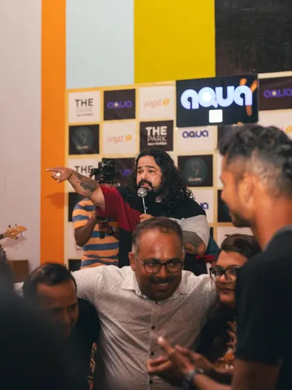 Leading the crowd in a singalong. This is a common sight at our shows, where we turn the entire venue into a choir.