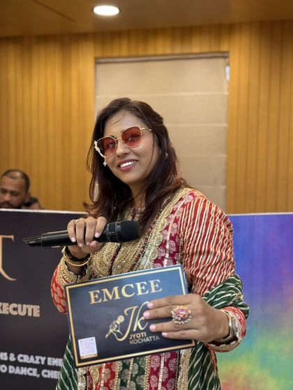 Mic in hand at the Anumodna ceremony. Hosting spiritual events requires a different kind of energy, one of devotion and respect, which I am always humbled to provide.