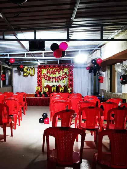 A wide view of the 50th birthday party hall setup.