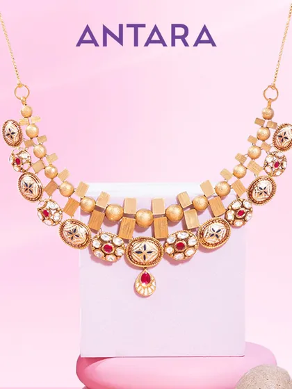 Geometry, but make it iconic. This necklace plays with sharp lines, effortless curves, and 22kt matte gold, creating a statement of power and poise for the woman who wears it.