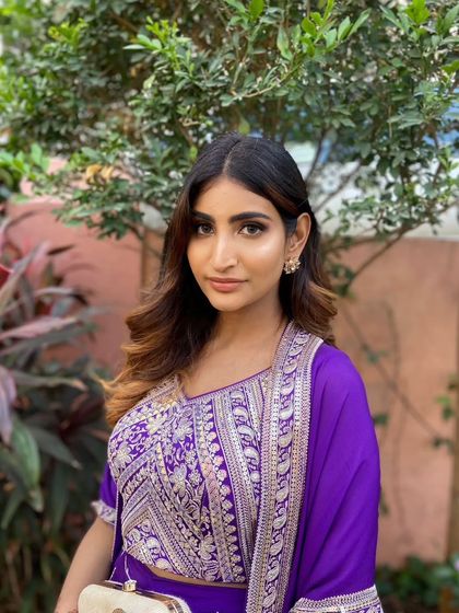Baraat ready. This wedding guest looks chic and stylish with her soft glam makeup and modern, side-swept hair.