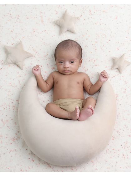 An awake and curious little star-gazer. It's always special when we capture moments with the baby's eyes open, looking right at the camera.