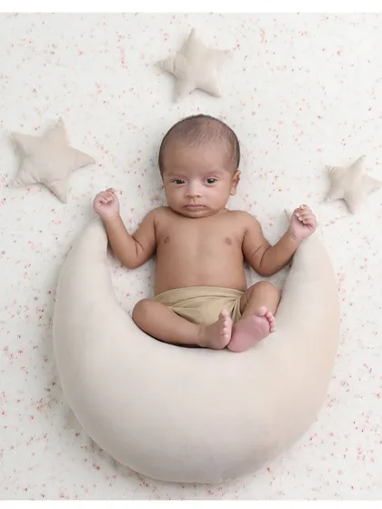 An awake and curious little star-gazer. It's always special when we capture moments with the baby's eyes open, looking right at the camera.