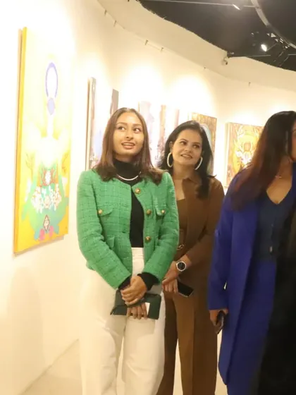 Here I am at the Lokayata Art Gallery, surrounded by my work and fellow art lovers. The energy and conversations at these events are what fuel my passion to create more.