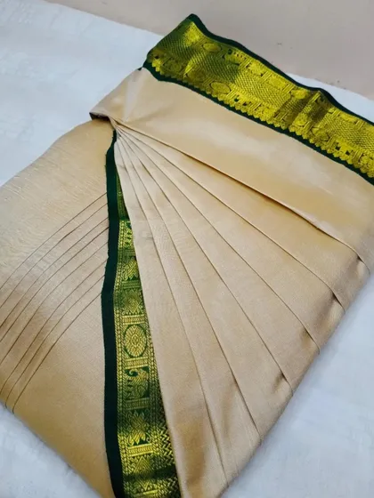 Believe me when I say you can drape this elegant beige and green saree in less than 5 minutes.
