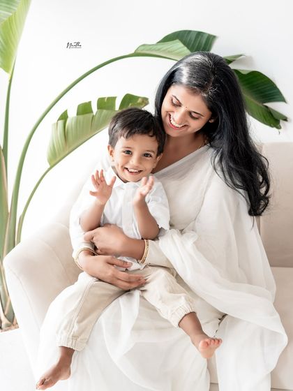 A beautiful portrait of a mother and son, sharing a happy moment in the studio.