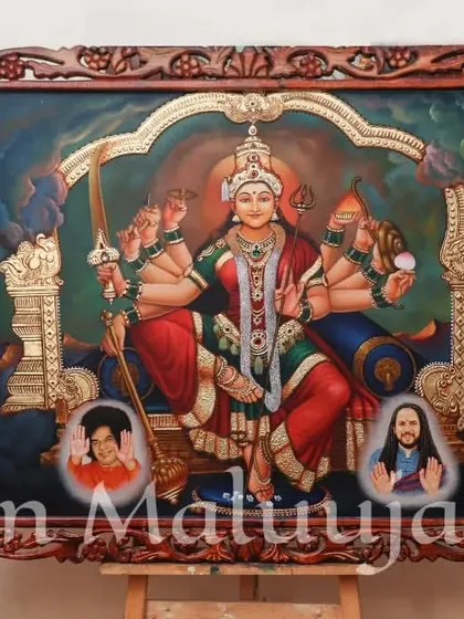 A custom Tanjore painting of Maa Durga, created for a client. The artwork includes small portraits of the patrons at the base, making it a deeply personal and sacred piece for their home.