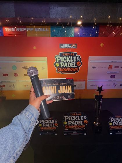 I've got my mic, so I'm in my element. This shot from the TSRS Pickle & Padel Showdown captures the essence of what I do: bringing people together for a memorable event.