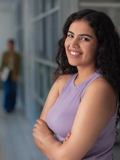 A confident, professional portrait for Images Bazaar. This type of headshot is perfect for corporate websites, brochures, and any branding that needs a friendly and approachable face.