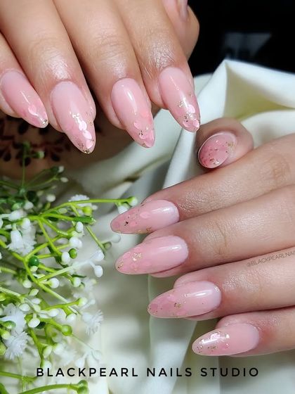 A beautiful example of inbuilt Myler nails in a flawless nude shade. This technique provides a subtle, encapsulated sparkle that is both elegant and convenient.