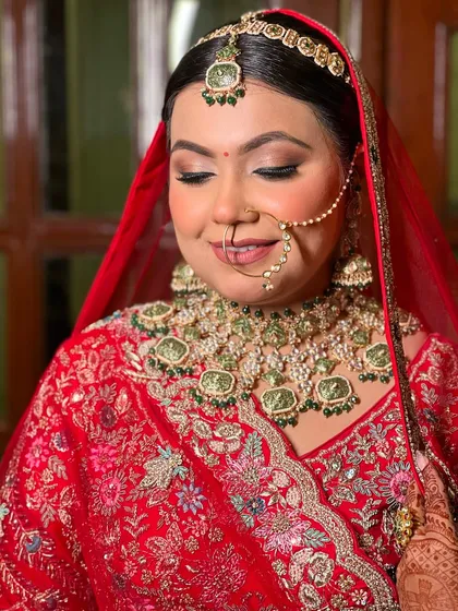 A close-up of the same bride, showing the soft, shimmery eye makeup and perfectly matched lip colour.
