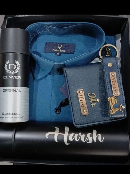 A blue Allen Solly shirt hamper with a personalized wallet, keychain, and flask, great for a birthday or anniversary.