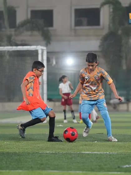 We're not just teaching skills, we're building confidence. A young player dribbles with focus at our Mulund center.