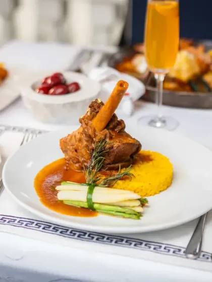This slow-braised lamb shank is pure comfort and tradition. Cooked with fragrant herbs until it is perfectly tender, it’s a dish that warms the soul, served here with asparagus and saffron rice.